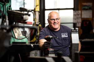 happy worker with drill