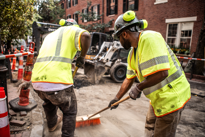 men sweeping