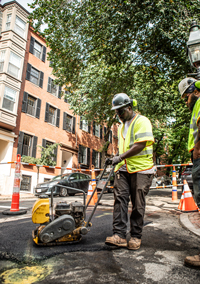 man paving concrete