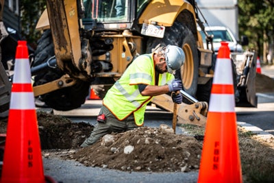 man digging in hole